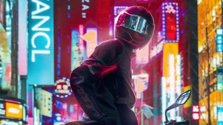Neon Biker in a Futuristic Cityscape wallpaper