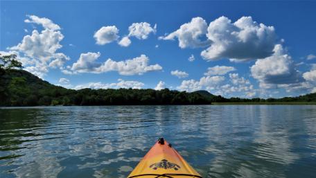 Serene Kayaking Adventure on a Tranquil Lake wallpaper