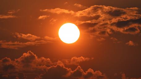 Golden Sunset Over Fiery Orange Sky wallpaper