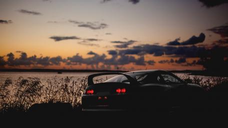 Sleek Toyota Supra at Dusk by the Water wallpaper