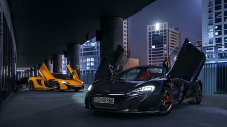 Sleek McLaren Dream Cars Under City Lights wallpaper