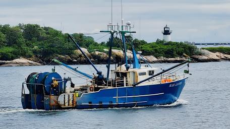Fishing Boat on Calm Waters in 4K Resolution wallpaper