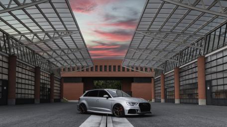 Sleek Audi Tuning Under Dramatic Skies wallpaper