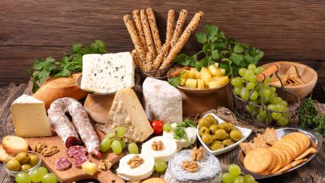 Delicious Cheese and Tapas Spread for Gourmet Lovers wallpaper