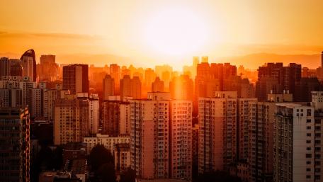 Golden Sunset Over a City Skyline wallpaper