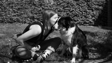 Heartwarming Dog Bonding Moment in Monochrome Photography wallpaper