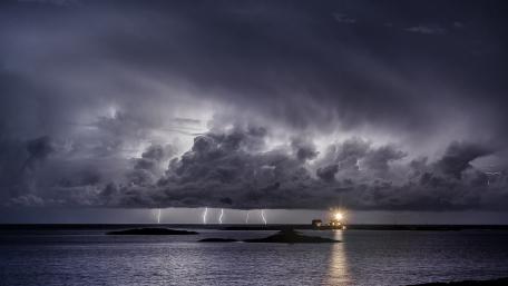 Electric Fury Over Tranquil Waters wallpaper