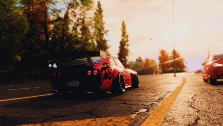 Vibrant Sunset Drive with a Stylish Car wallpaper