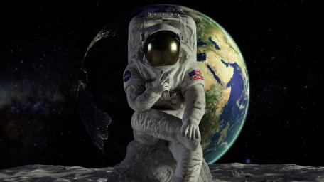 Astronaut Contemplating Earth from Space wallpaper