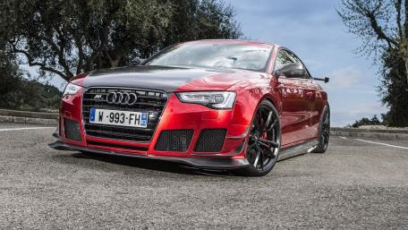 Sleek Audi RS5 in Bold Red and Black Style wallpaper