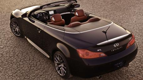 Sleek Infiniti Cabriolet on a Rustic Background wallpaper