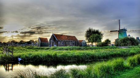 Charming Windswept Village Landscape wallpaper