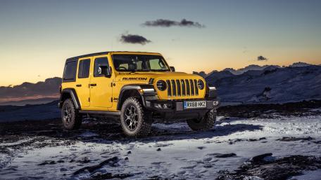 Vibrant Yellow Jeep Wrangler Rubicon in Stunning Landscape wallpaper