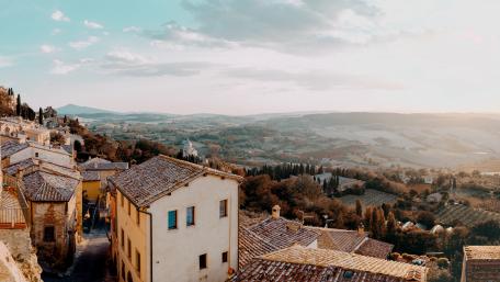 Charming Old Town Overlooking Serene Countryside wallpaper