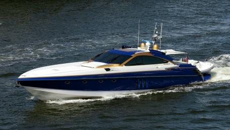 Sleek and Stylish Cigarette Boat on the Water wallpaper