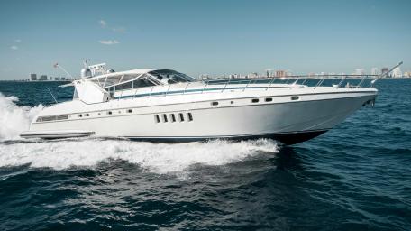 Sleek Motorboat Cutting Through Waves in 5K Resolution wallpaper