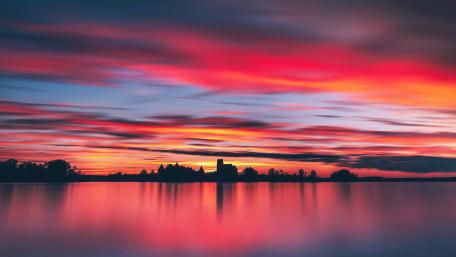 Serene Evening Silhouette Over Water wallpaper
