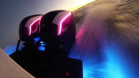 Dynamic Outboard Motor Experience Under the Sunset Glow wallpaper