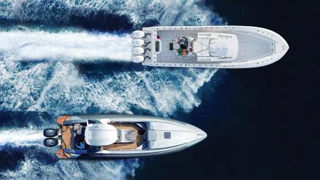Sleek Yachts Gliding on Water Waves wallpaper