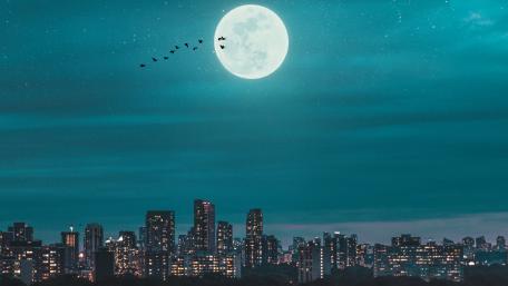 Majestic Moon Over City Skyline wallpaper