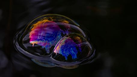 Colorful Bubbles on Dark Water Surface wallpaper
