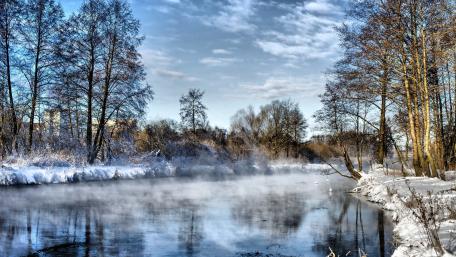 Winter River Serenity in a Frosted Landscape wallpaper