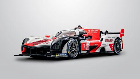 Sleek Hypercar Against a Minimalist White Background wallpaper