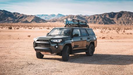 Adventure Ready Toyota SUV in Desert Landscape wallpaper