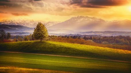 Serene Sunset Over Rolling Hills Landscape wallpaper