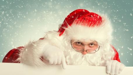 Jolly Santa Claus Spreading Holiday Cheer wallpaper