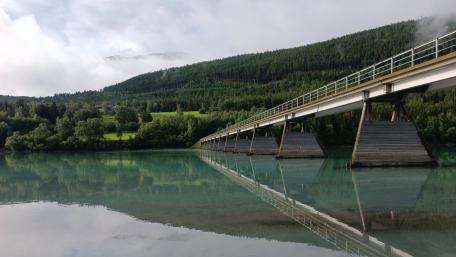 Tranquil River Reflection Amidst Nature's Beauty wallpaper