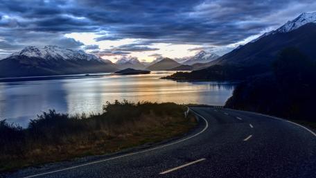 Sunset Over Serene Mountain Highway wallpaper