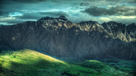Majestic Mountain Range Glowing in Morning Light wallpaper