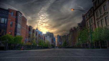 Sun Set Against Urban Architecture wallpaper