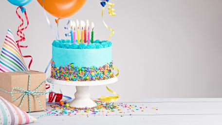 Colorful Birthday Cake Celebration Scene for Festive Moments wallpaper