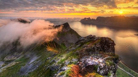 Majestic Fjord at Sunset Over Mountain Peaks wallpaper