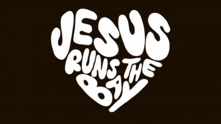 Jesus Runs the Bay in White Text on Black Background wallpaper