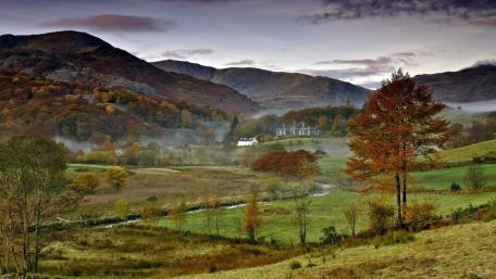 Serene Autumn Landscape with Rolling Hills wallpaper
