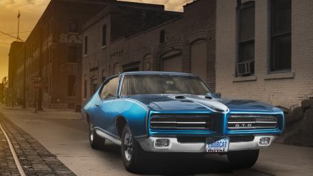 Classic Pontiac GTO on Urban Street Scene wallpaper