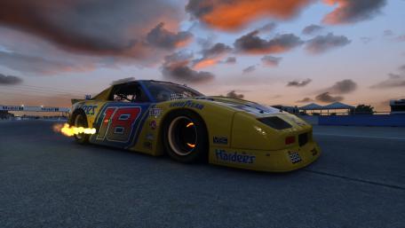 Roaring Power at Dusk: Sports Car in Action wallpaper