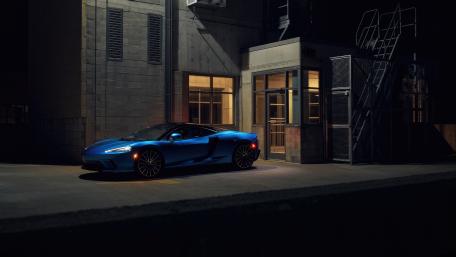 Sleek McLaren GT in Urban Nightscape wallpaper