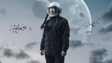 Mystical Astronaut in a Celestial Landscape wallpaper