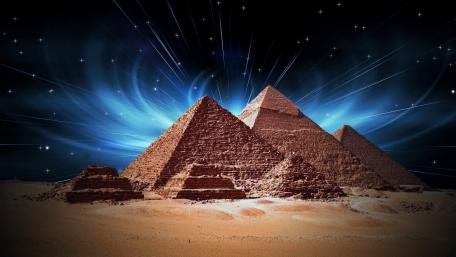 Mystical Pyramids Under a Starry Night Sky wallpaper