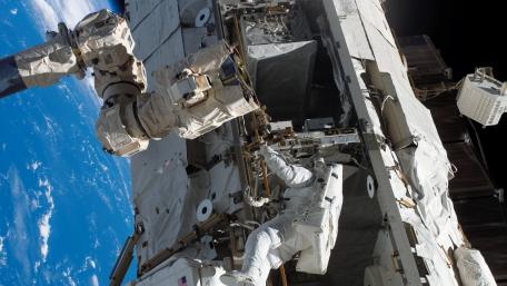 Astronauts Working on the International Space Station wallpaper