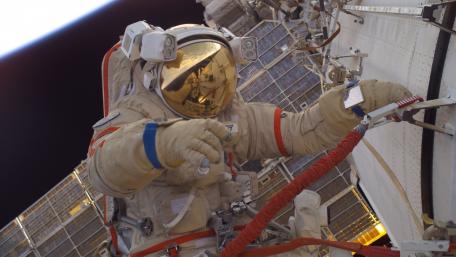 Astronaut on the International Space Station in Space Suit wallpaper