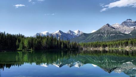 Serene Mountain Reflection Over Calm Lake wallpaper