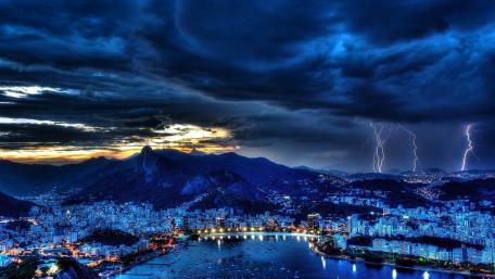 Dramatic Lightning Over a Cityscape Nightview wallpaper