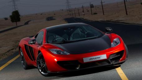 Sleek McLaren on an Open Road in the Desert wallpaper