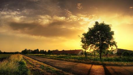Rustic Sunset Over Serene Farmland wallpaper
