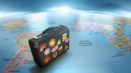 Adventure Awaits with Your Baggage World Map Wallpaper wallpaper